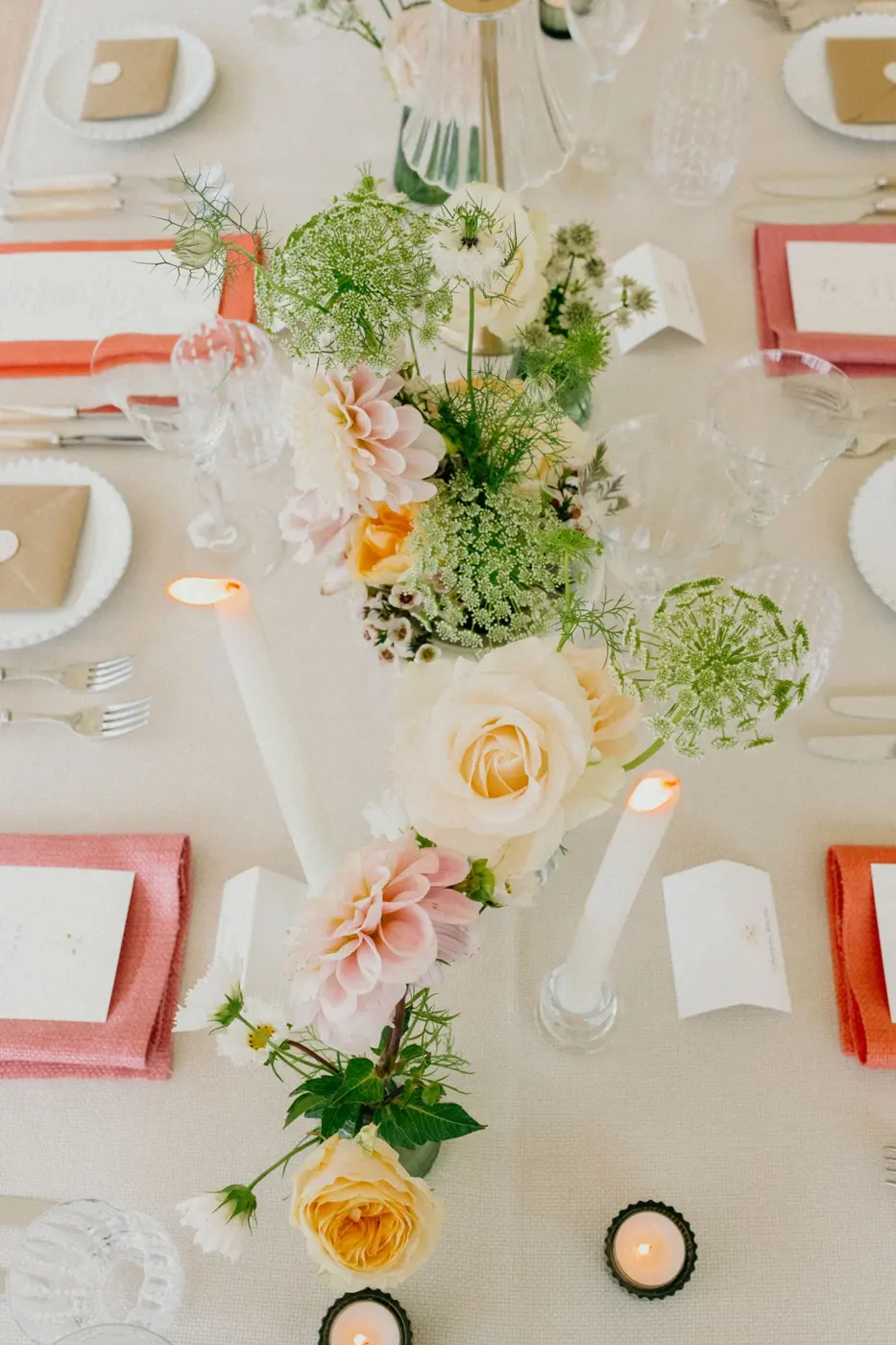 Flowers arranged along a wedding table